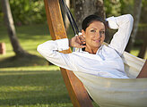 20-25 years woman portrait ralaxing on hammock at exotic surrounding, bali indonesia