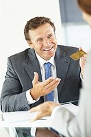 Banker handing over credit card