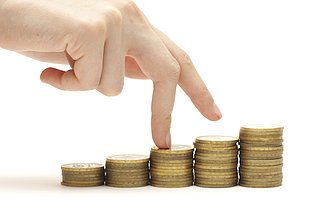 Hand and money staircase isolated on white background
